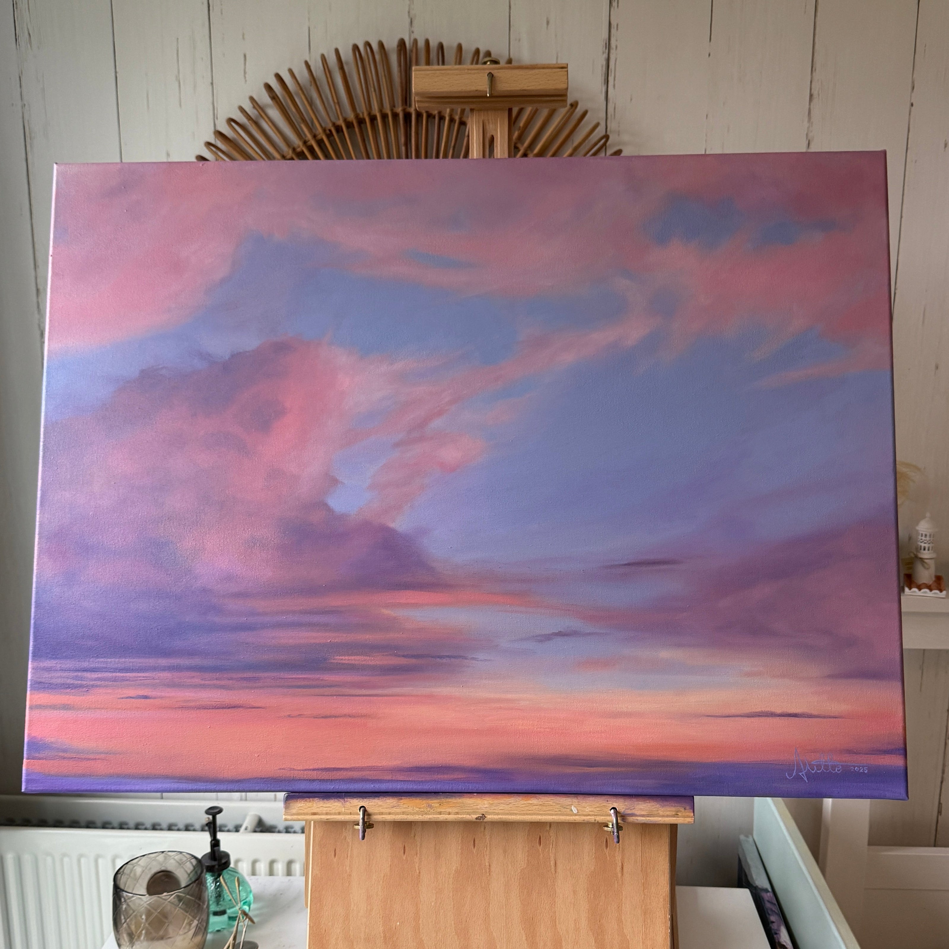 Large oil painting of a pink sunset 